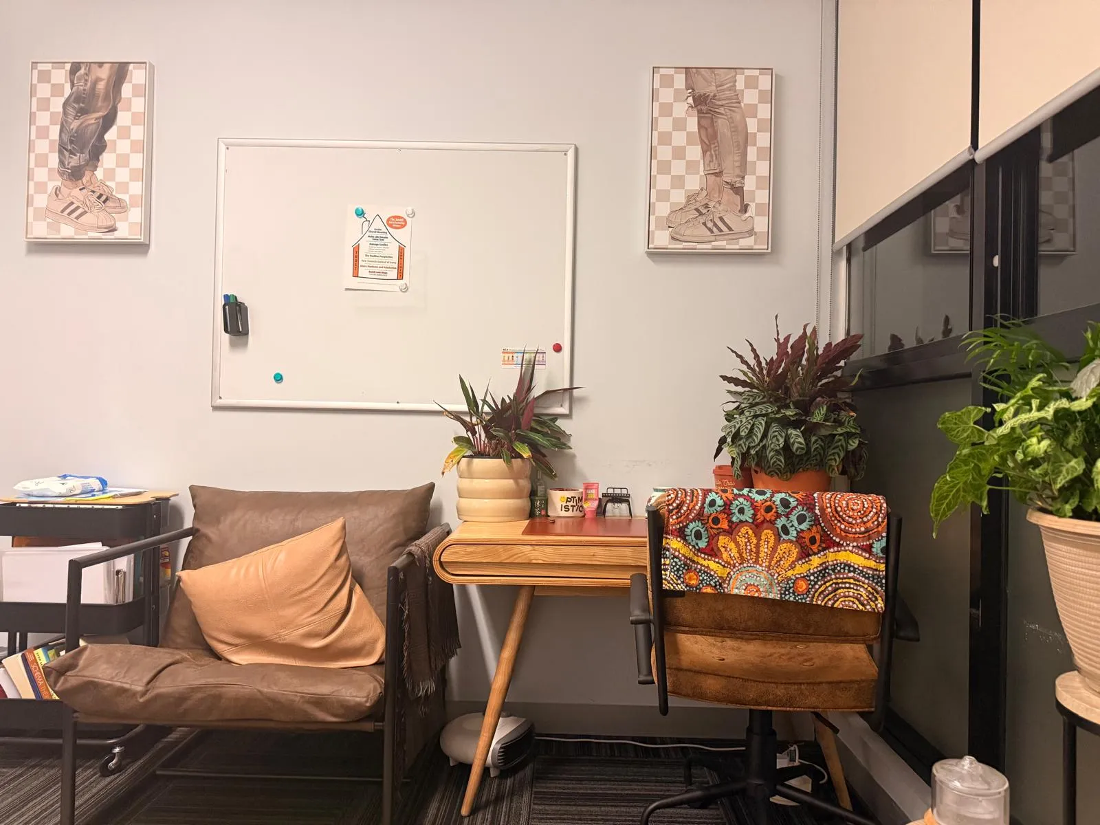 A leather armchair beside the desk — a quiet corner of the therapy space